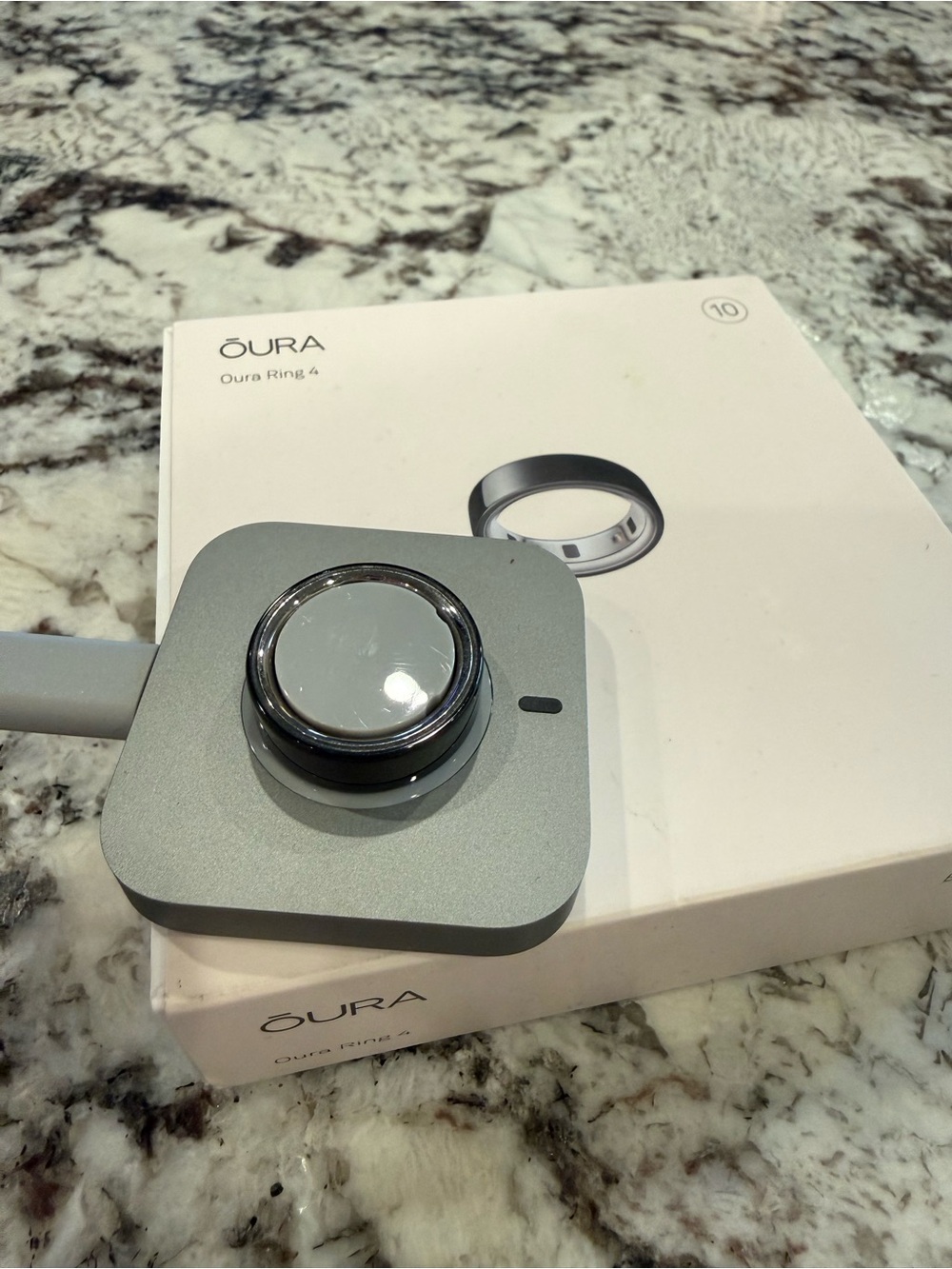 Oura Ring Charging Dock with Black Metallic Ring